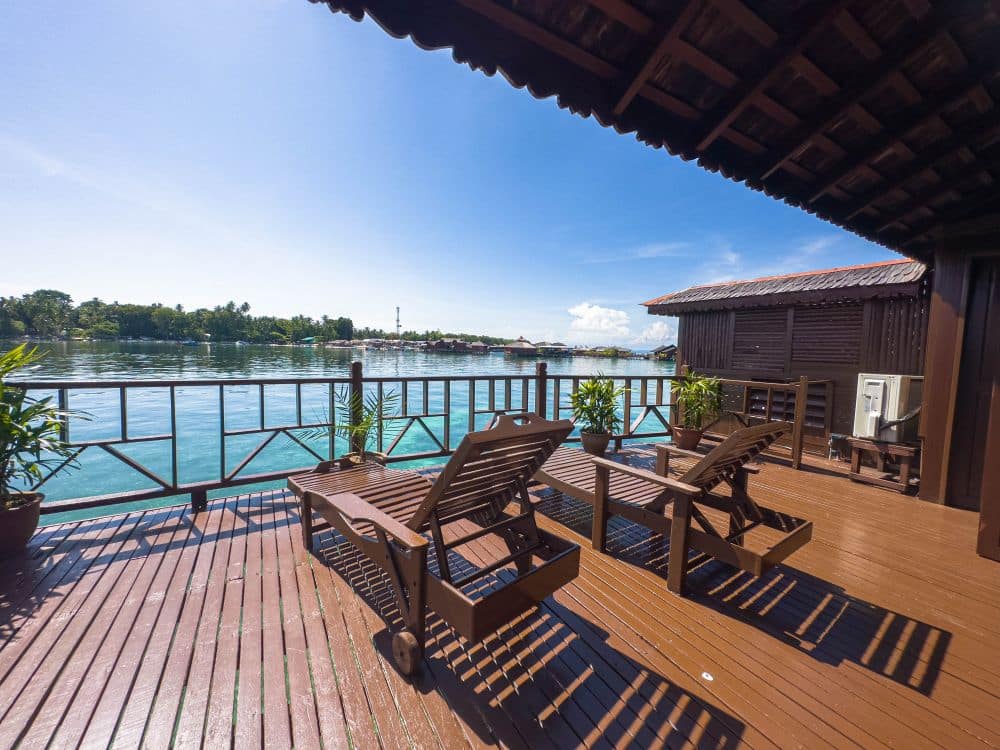 The beautiful balcony seaviews from the Grand Deluxe Cottage at Sipadan Water Village, an ideal spot for relaxing over-the-water.