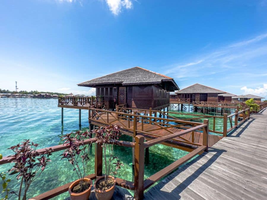 An outdoor view of the Grand Deluxe Chalet at Sipadan Water Village on Mabul island, highlighting its premium location over the water.
