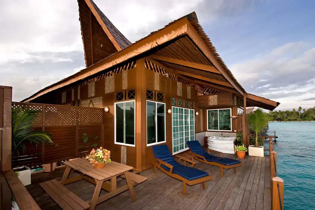 Private outdoor jacuzzi on the balcony of a Borneo Villa at Mabul Water Bungalows, offering ultimate relaxation with stunning ocean views.