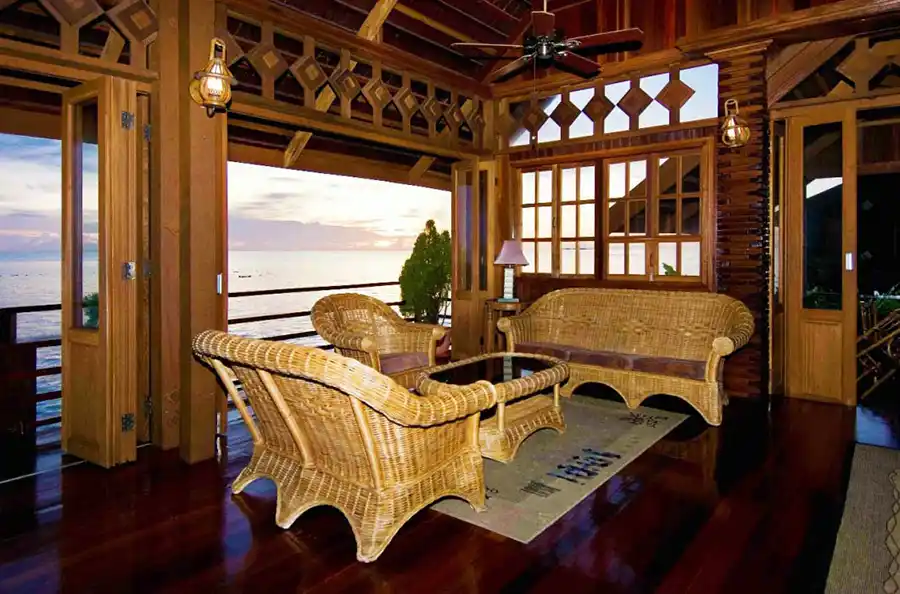 Elegant and modern Lana Lounge area at he Mabul Water Bungalows luxury resort, with stylish furniture and an open design perfect for evening relaxation while enjoying the sunset and seaviews.